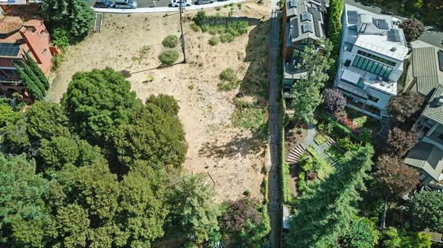 an aerial view of residential house with outdoor space