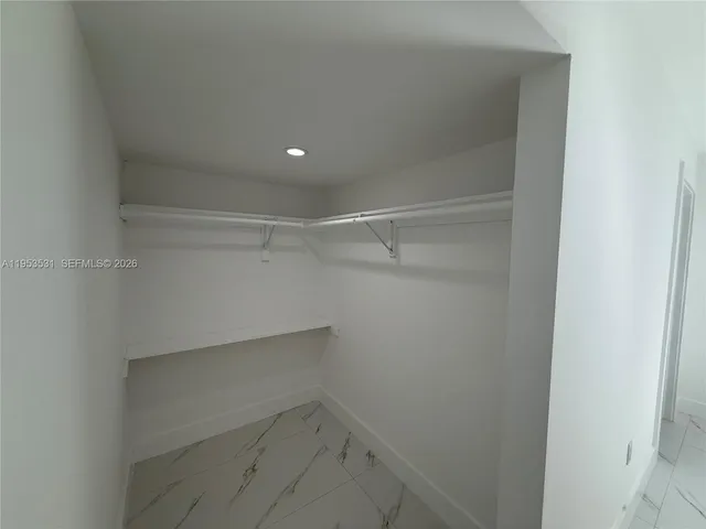 a view of an empty walk in closet