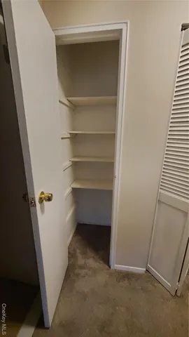 a view of an empty room with windows