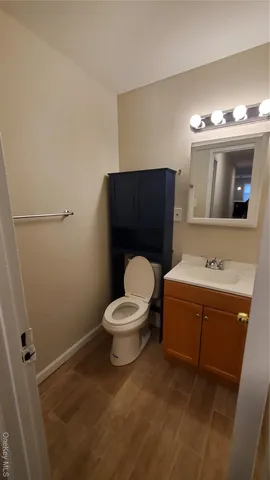 a bathroom with a shower curtain and a sink
