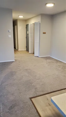 a view of an empty room and window