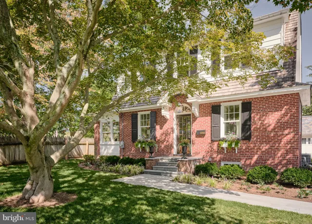 a kitchen with kitchen island granite countertop a sink cabinets and window