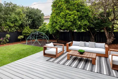 a view of outdoor sitting area with furniture