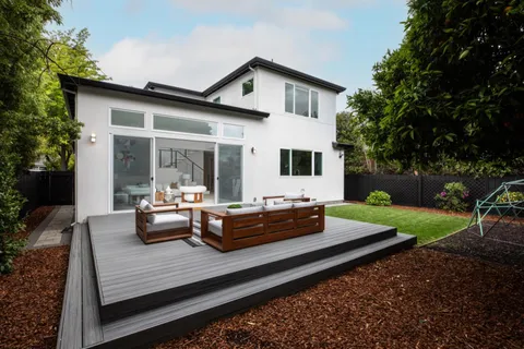 a view of outdoor sitting area with furniture