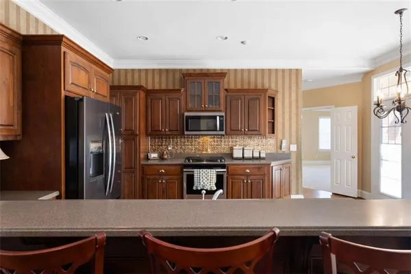 a view of room with a window and a ceiling fan