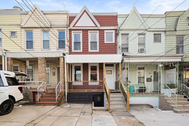 a front view of a building with a porch