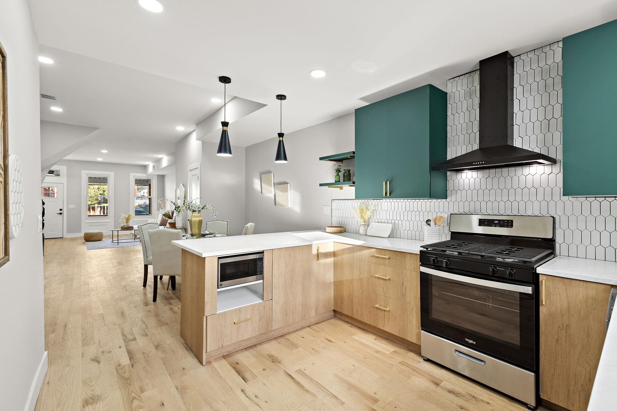 77 Boyd Avenue Jersey City, NJ 07304 - Photo 18 of 26 a kitchen with a stove and a microwave