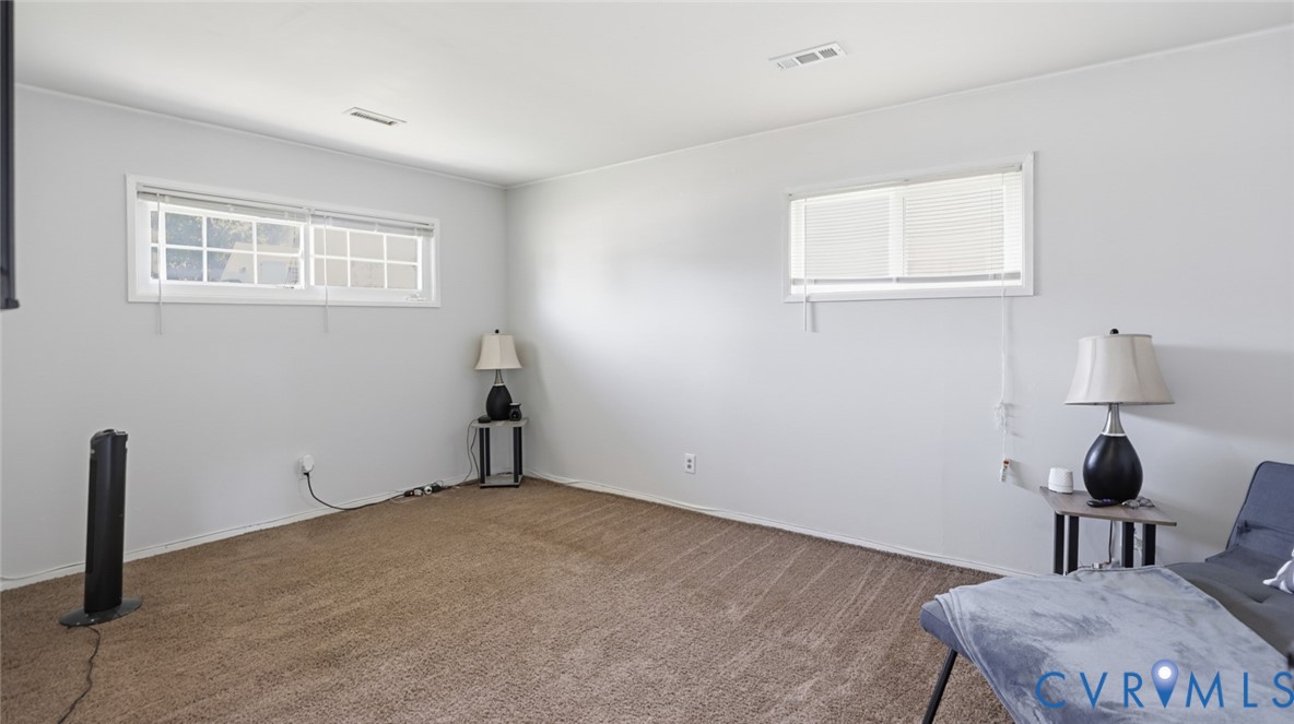 1310 Andover Road Henrico, VA 23229 - Photo 22 of 43 Spacious room featuring light gray walls, brown pa