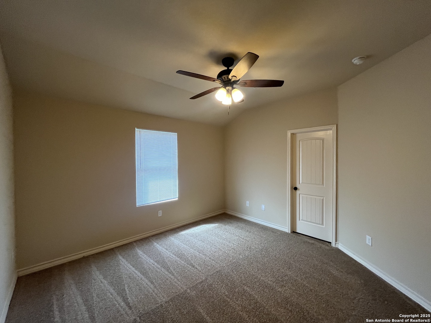6530 Marcel Way, Unit 103 San Antonio, TX 78233 - Photo 15 of 31 a view of an empty room with a window