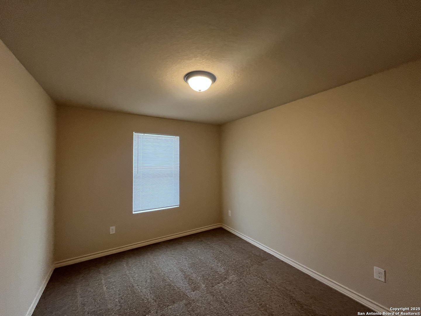 6530 Marcel Way, Unit 103 San Antonio, TX 78233 - Photo 19 of 31 an empty room with a empty space and window