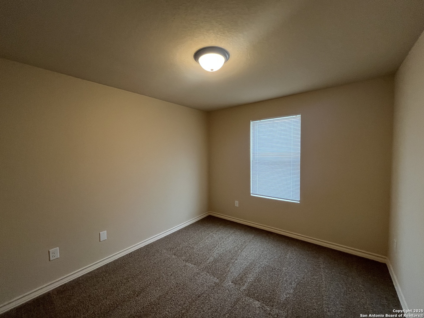 6530 Marcel Way, Unit 103 San Antonio, TX 78233 - Photo 20 of 31 an empty room with a window