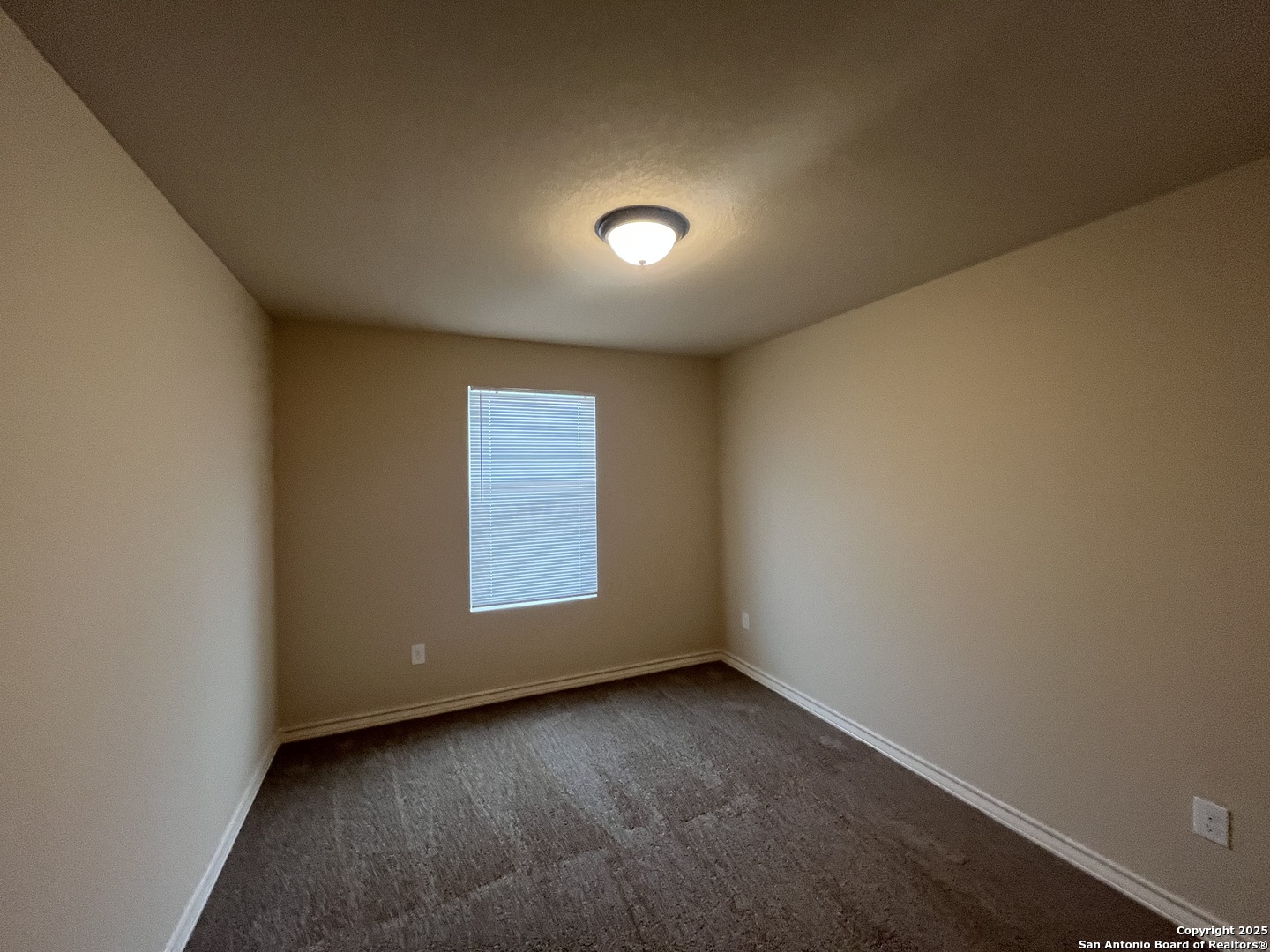 6530 Marcel Way, Unit 103 San Antonio, TX 78233 - Photo 25 of 31 an empty room with a window