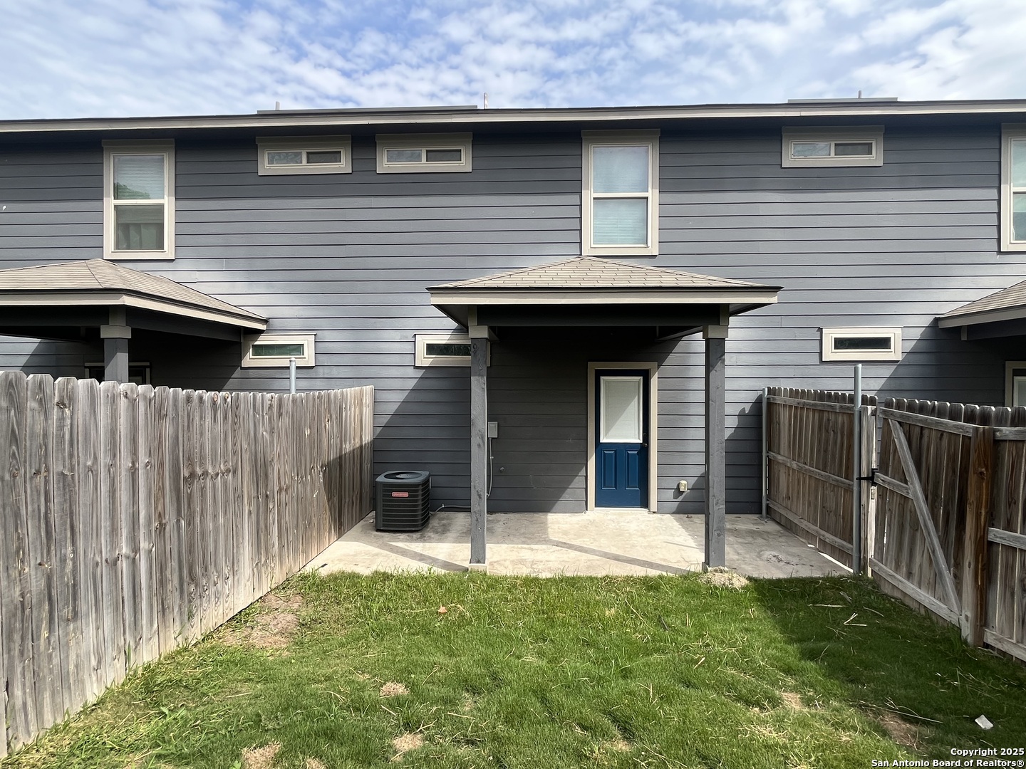 6530 Marcel Way, Unit 103 San Antonio, TX 78233 - Photo 31 of 31 a view of a house with a door and a yard