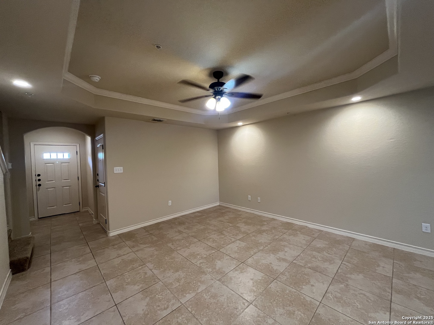 6530 Marcel Way, Unit 103 San Antonio, TX 78233 - Photo 5 of 31 an empty room with a ceiling fan and window