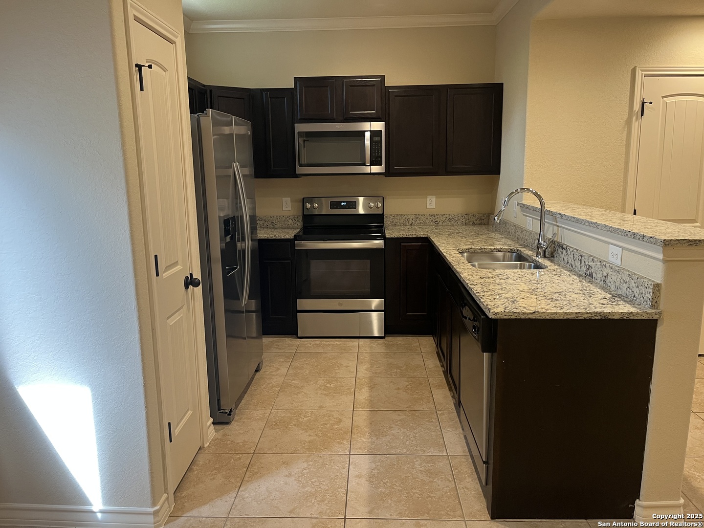 6530 Marcel Way, Unit 103 San Antonio, TX 78233 - Photo 8 of 31 a kitchen with stainless steel appliances granite countertop a refrigerator stove and sink