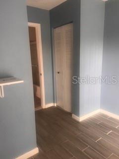 5084 Downing Street, Unit 2 Orlando, FL 32839 - Photo 2 of 7 a view of a hallway with wooden floor
