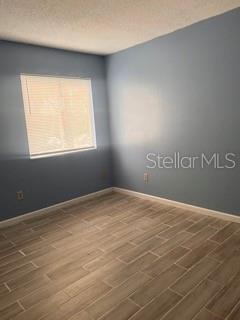 5084 Downing Street, Unit 2 Orlando, FL 32839 - Photo 3 of 7 an empty room with a window