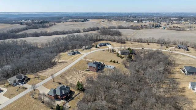 an aerial view of a house with outdoor space