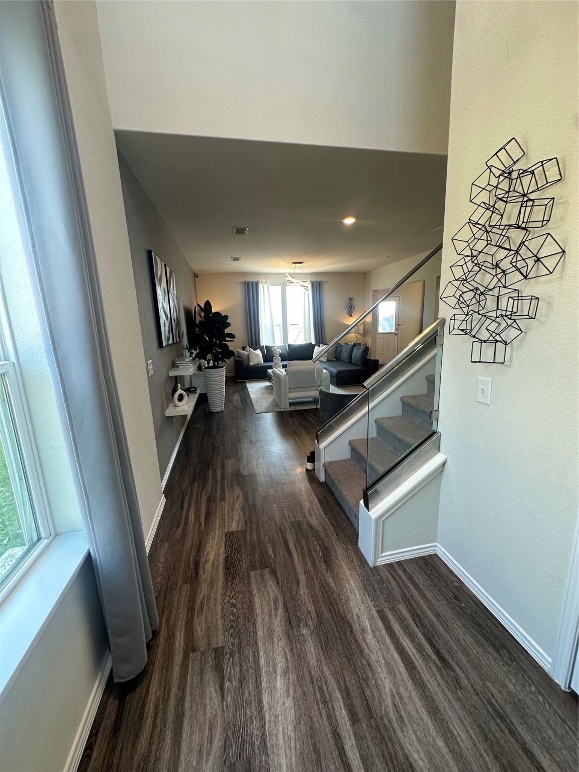 a view of a room with wooden floor