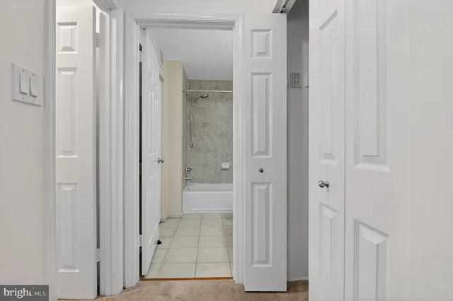 a bathroom with a shower and a glass door