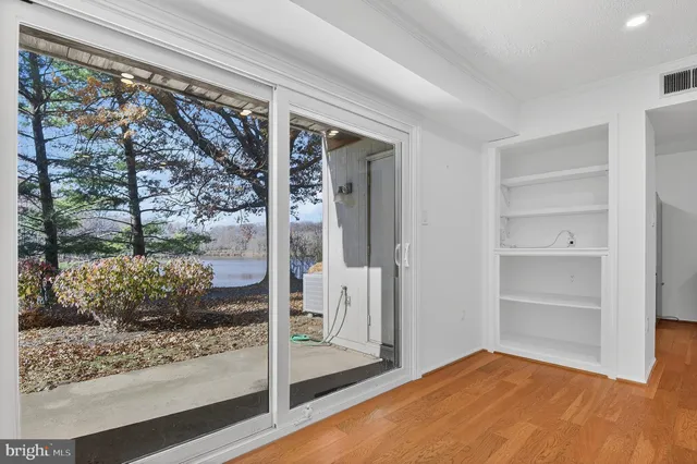 a view of a room with a large window