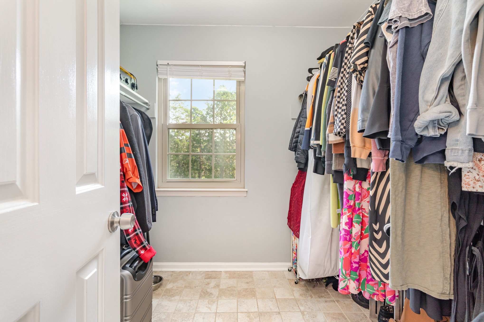 4001 Anderson Road, Unit B124 Nashville, TN 37217 - Photo 20 of 36 a view of walk in closet with clothes