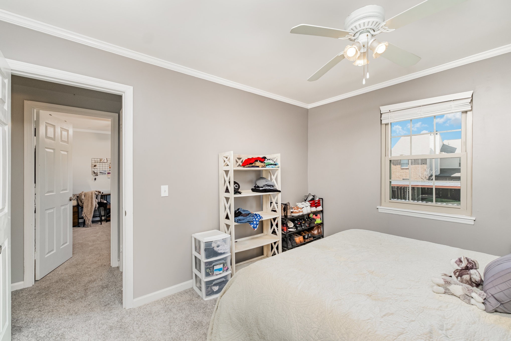 4001 Anderson Road, Unit B124 Nashville, TN 37217 - Photo 25 of 36 a bedroom with a bed chandelier and a window