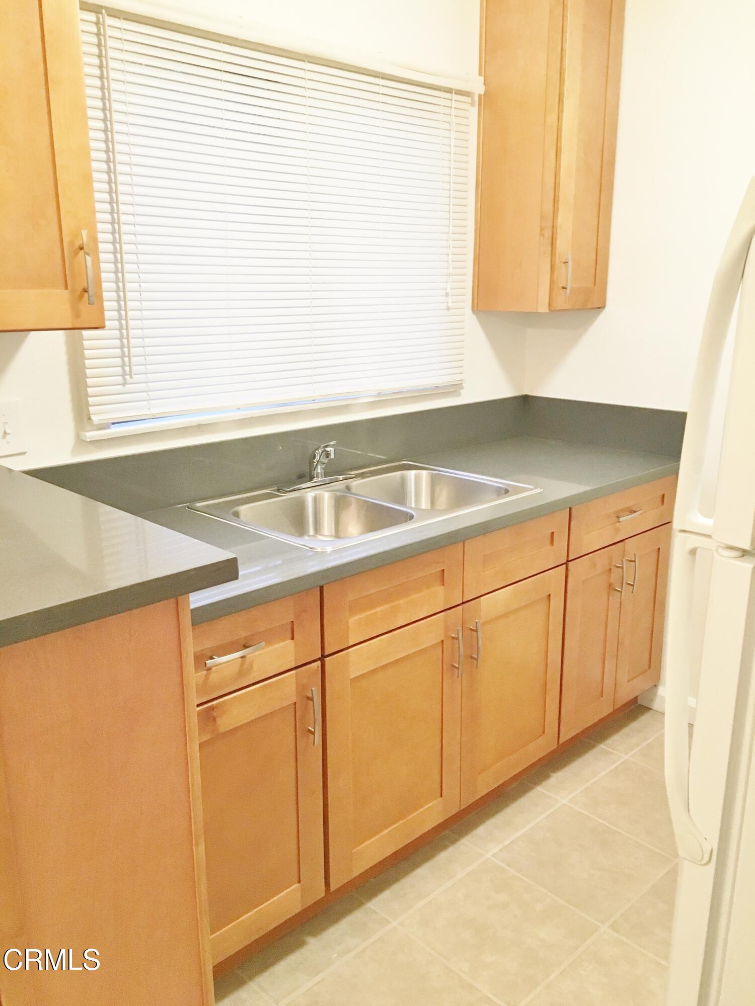 a bathroom with a sink and a window