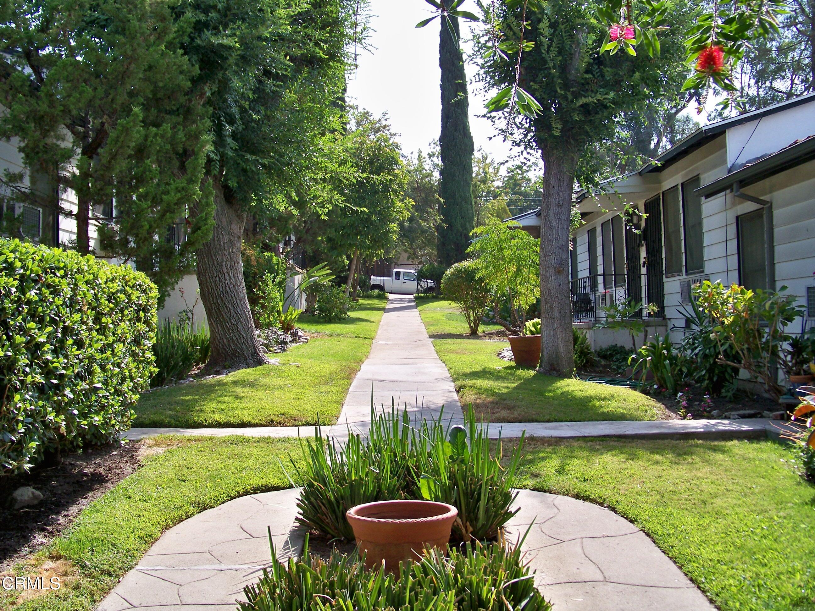 10155 Silverton Avenue, Unit 3 Tujunga, CA 91042 - Photo 3 of 4 a view of a garden with large trees