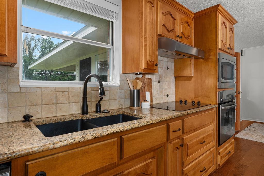 927 Stonewall-Preston Road Stonewall, LA 71078 - Photo 12 of 28 a kitchen with a sink and a window