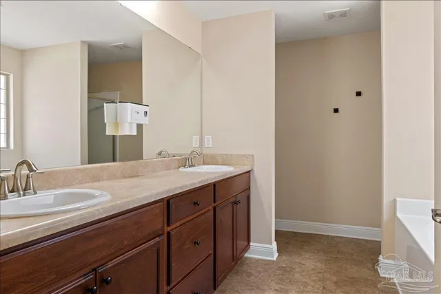 a white bath tub sitting next to a window