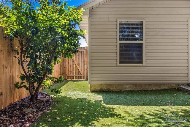 a view of a backyard of the house