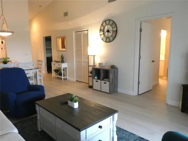 a living room with furniture and a table