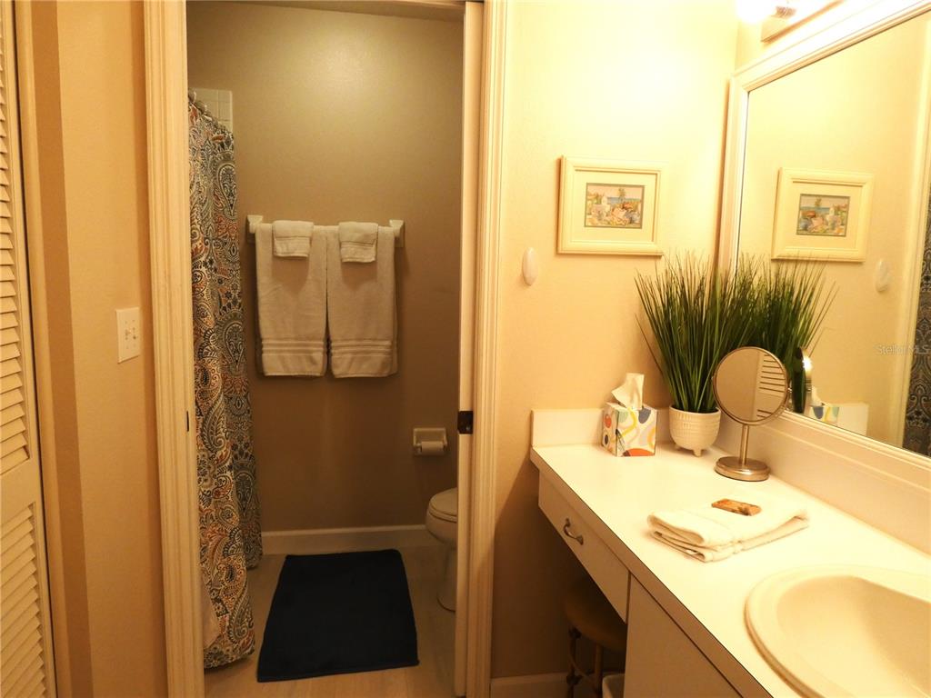 9300 Clubside Circle, Unit 1307 Sarasota, FL 34238 - Photo 16 of 40 a bathroom with a sink and a mirror