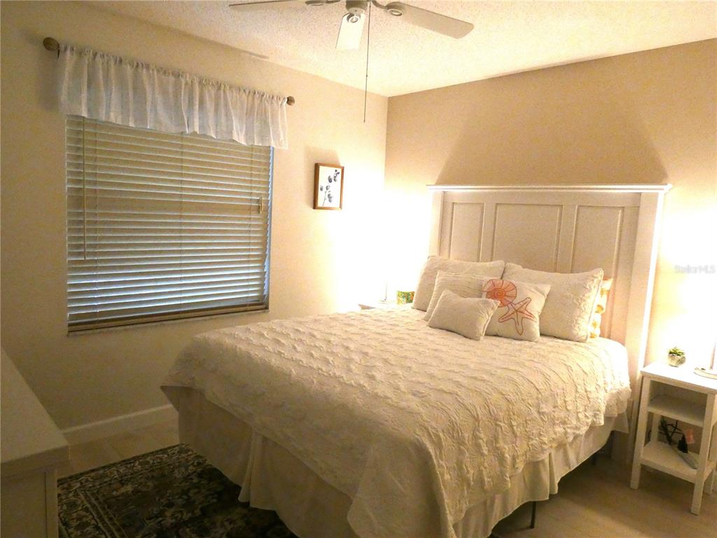 9300 Clubside Circle, Unit 1307 Sarasota, FL 34238 - Photo 17 of 40 a bedroom with a bed and a window
