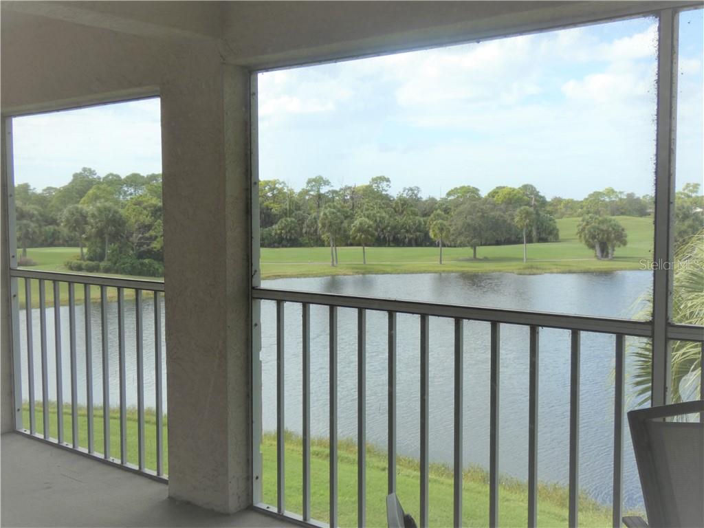 9300 Clubside Circle, Unit 1307 Sarasota, FL 34238 - Photo 21 of 40 a view of a lake from a balcony