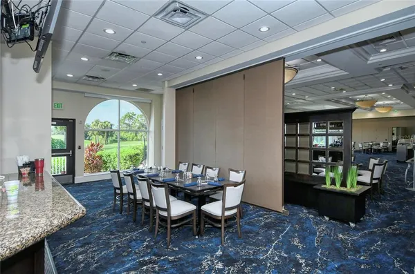 a view of a dining room with furniture window and outside view