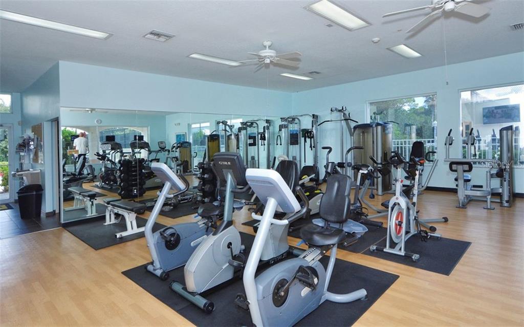 9300 Clubside Circle, Unit 1307 Sarasota, FL 34238 - Photo 32 of 40 a view of a room with gym equipment