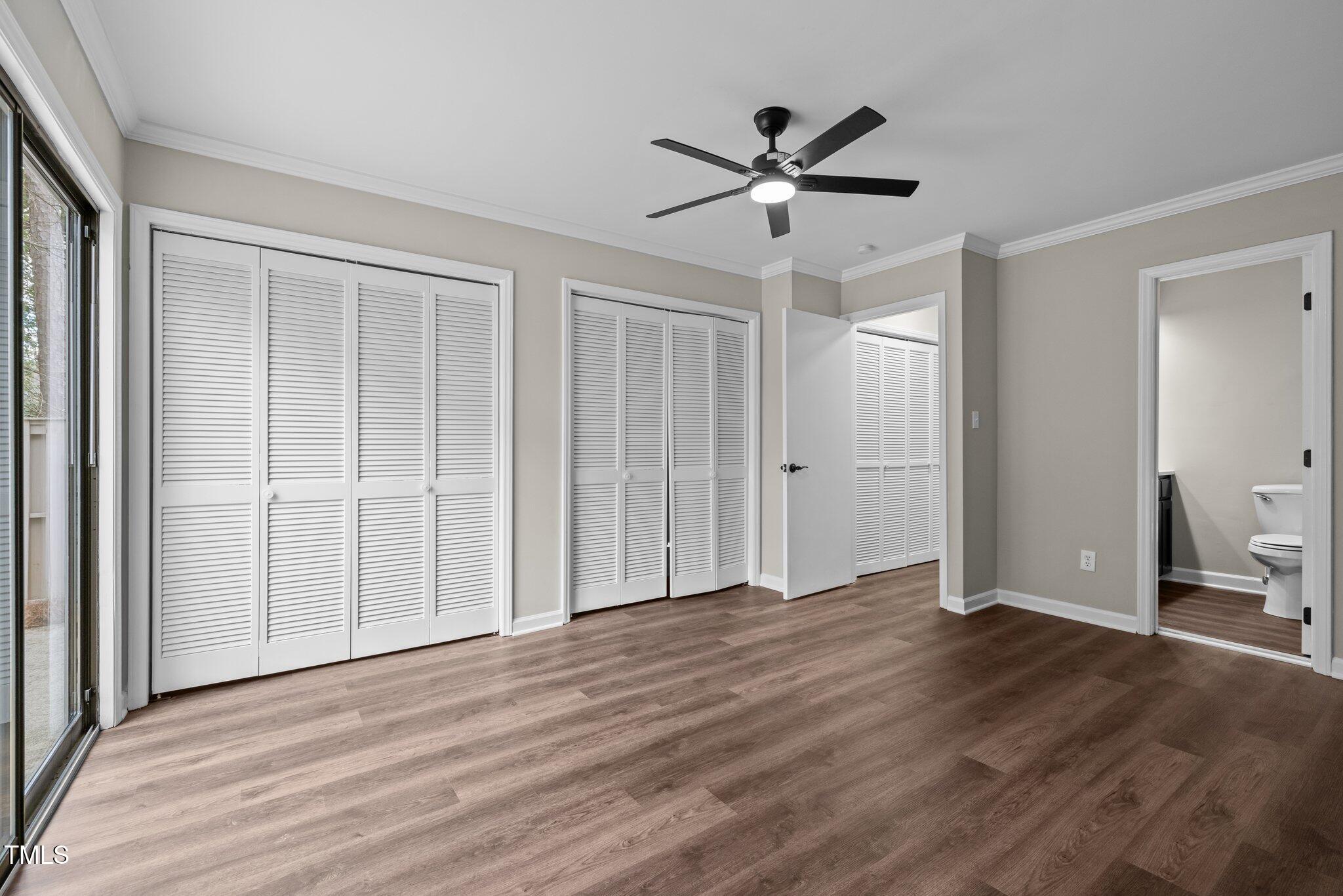 5850 Branchwood Road Raleigh, NC 27609 - Photo 15 of 27 a view of empty room with wooden floor and window