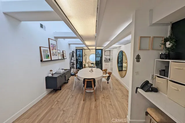 a living room with furniture and a mirror