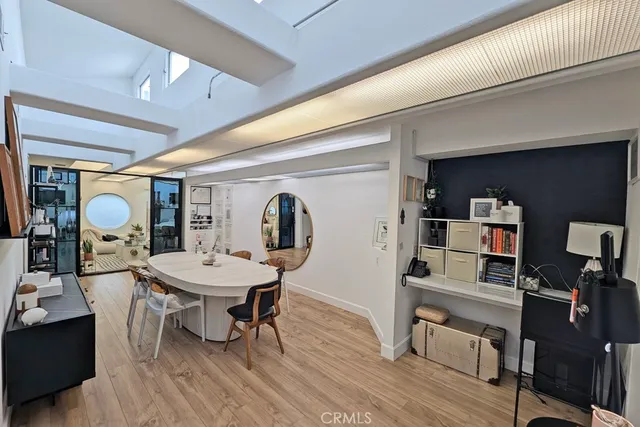 a living room with furniture a rug and a painting