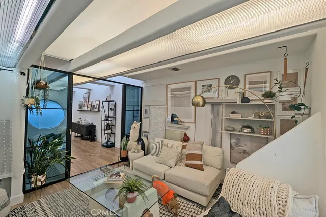 a bedroom with furniture and a wooden floor