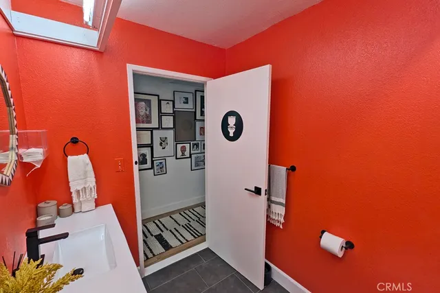 a view of living room with furniture and a fireplace