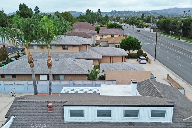 an aerial view of residential houses with outdoor space