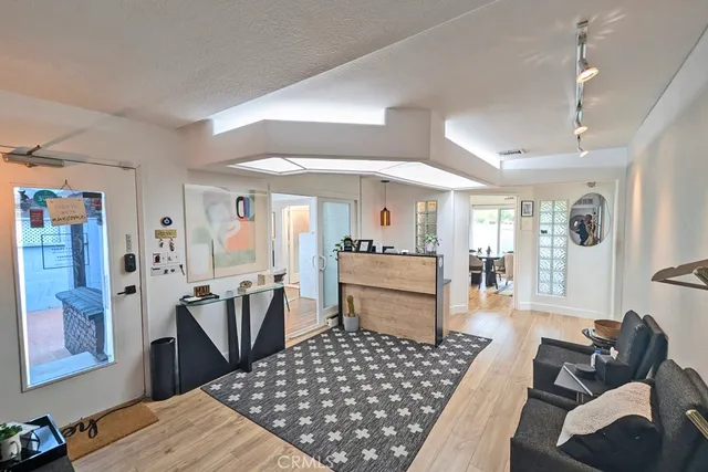 a dining room with furniture and wooden floor