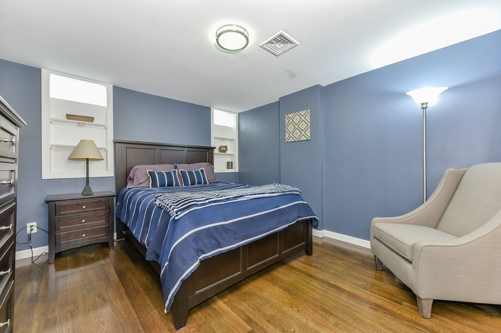 253 Gold Street, Unit 1 Boston, MA 02127 - Photo 11 of 19 a bedroom with a bed and a couch