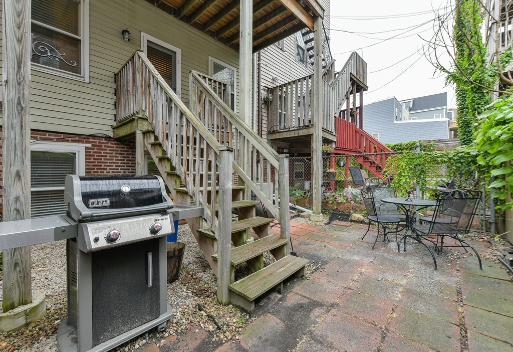 253 Gold Street, Unit 1 Boston, MA 02127 - Photo 15 of 19 a view of a chairs with a table in the patio