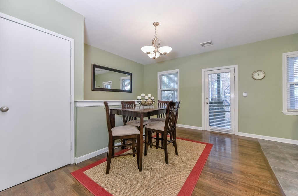 253 Gold Street, Unit 1 Boston, MA 02127 - Photo 2 of 19 a view of a a dining room with furniture window and wooden floor