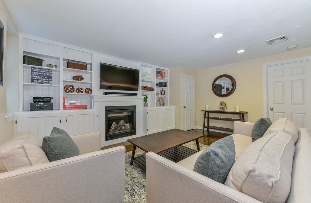 253 Gold Street, Unit 1 Boston, MA 02127 - Photo 9 of 19 a living room with furniture and a flat screen tv