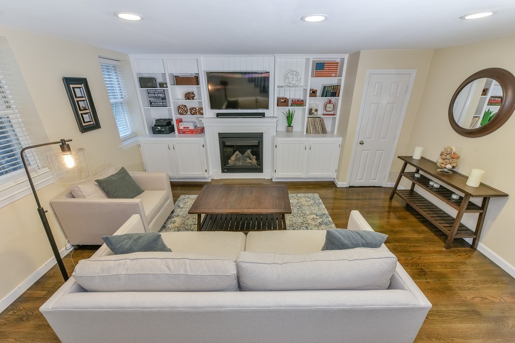 253 Gold Street, Unit 1 Boston, MA 02127 - Photo 10 of 19 a living room with furniture fireplace and flat screen tv